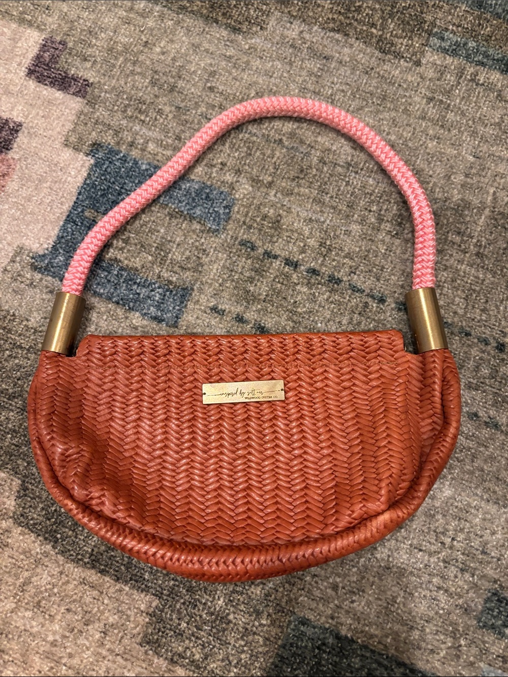 Woven Half-Moon Shoulder Bag in Rust with Pink Handle by Wildwood Oyster Club!